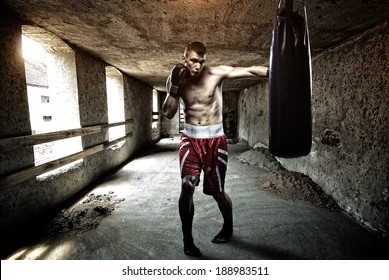 Young Man Boxing Workout In An Old Building