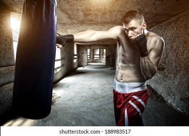 Young Man Boxing Workout In An Old Building