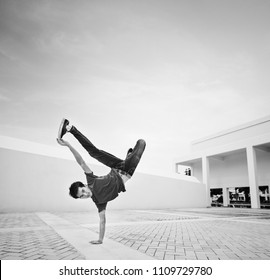 Young Man Break Dancing At A Rooftop