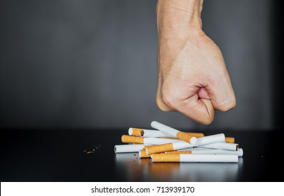Young Man Breaking Cigarette