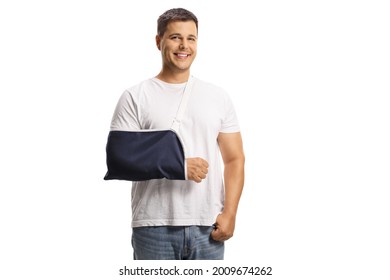 Young Man With A Broken Arm Wearing An Arm Splint And Smiling Isolated On White Background