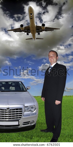 Young man in business\
attire against green pasture and sky, with executive car and plane\
in sky