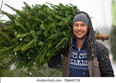 Young Man Buying Christmas Tree
