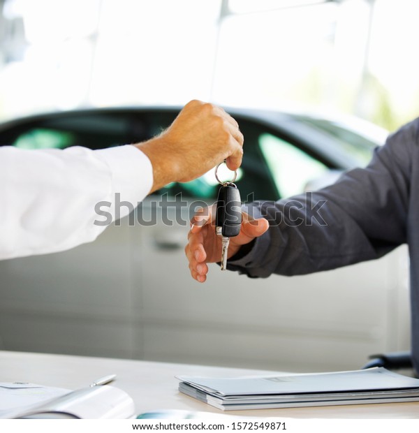 A young man buying a new
car