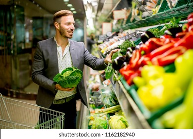 Young Man Buying Vegetables Supermarket Stock Photo 1162182940 ...