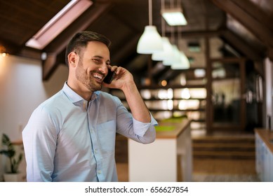 Young Man Calling On The Phone In Home