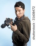 Young man with a camera