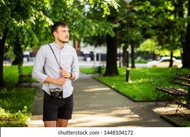
young man with a camera