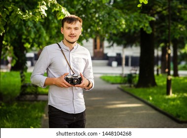 
young man with a camera