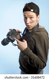 Young man with a camera
