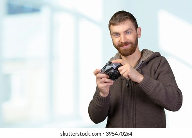 Young man with camera