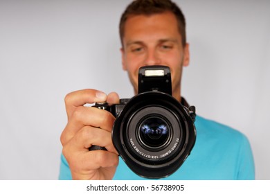 Young man with camera