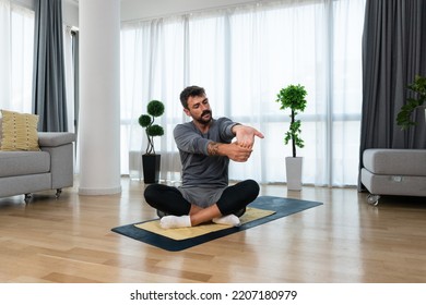 Young Man Cancer Survivor Practicing Home Workout Yoga Training, Stretching Muscles And Breathing Exercise For Healthy Life After Long Struggle With Sickness And Pain.