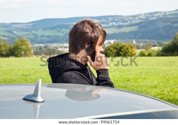 young man with the car\
phone