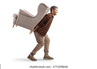 Young Man Carrying An Armchair On His Back Isolated On White Background