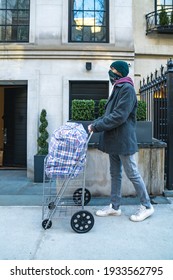 Young Man Carrying Large Bazar Bag In Cart For The Thrift Shop, Charity, Cleaning Space, Moving, Donation Concept. Wearing Face Mask. Outdoors