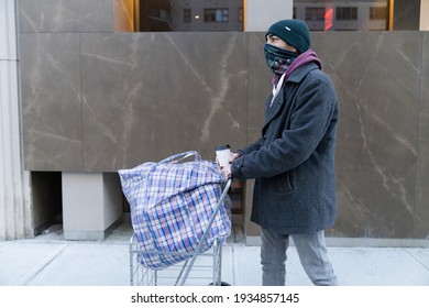 Young Man Carrying Large Bazar Bag In Cart For The Thrift Shop, Charity, Cleaning Space, Moving, Donation Concept. Wearing Face Mask. Outdoors