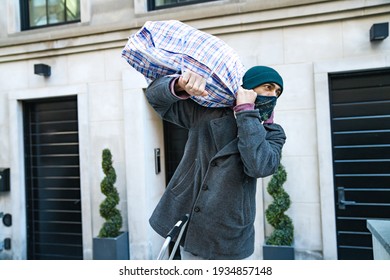 Young Man Carrying Large Bazar Bag For The Thrift Shop, Charity, Cleaning Space, Moving, Donation Concept. Wearing Face Mask. Outdoors