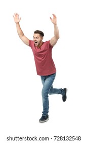 Young Man In Casual Clothes Running Against White Background