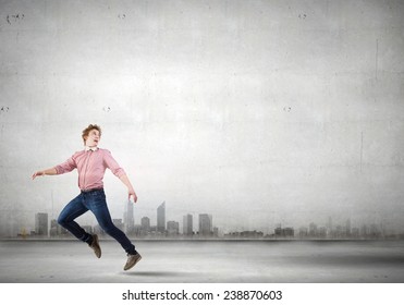 Young man in casual running away from something