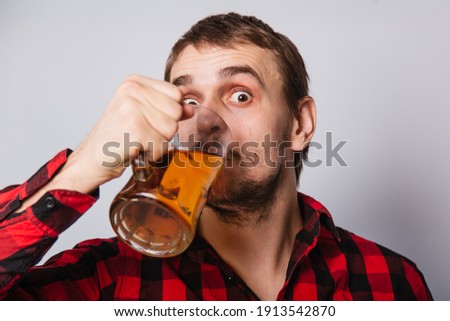 Similar – Image, Stock Photo Portrait of a young man with a beer glass in his hand