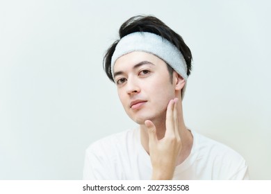 Young Man Checking Skin Condition