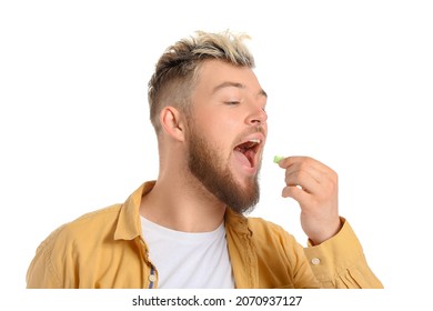 Young Man With Chewing Gum On White Background