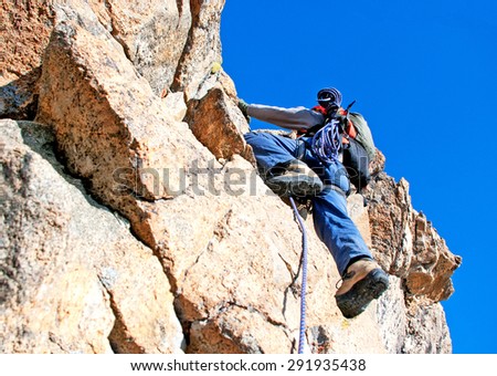 Image, Stock Photo Rock climber clinging to a cliff.