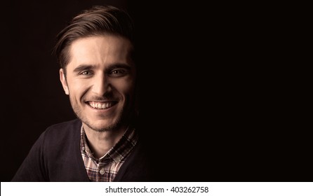 Young Man Close Up Portrait, On Black Background