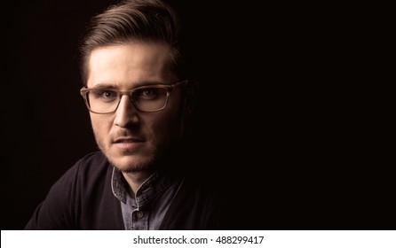 Young Man Close Up Portrait, On Black Background