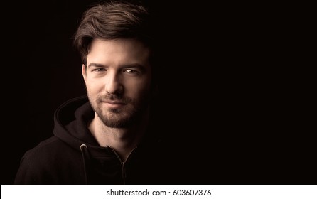 Young Man Close Up Portrait, On Black Background