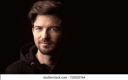 Young Man Close Up Portrait, On Black Background