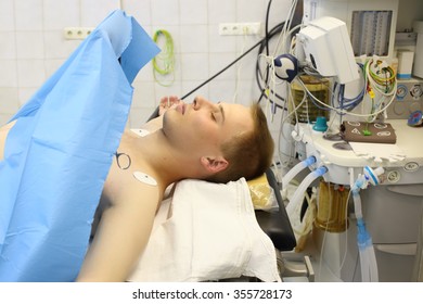 Young Man With Closed Eyes Lying On The Operating Table