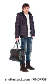 Young Man In Coat Holding Bag. Isolated On White Background