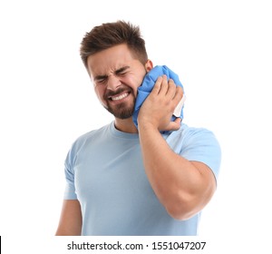 Young Man With Cold Compress Suffering From Neck Pain On White Background