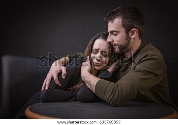 Young Man Comforting His Girlfriend Hugging Miscellaneous