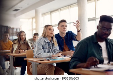 Young man communicating with female friend during a class at the university,  - Shutterstock ID 1955306803