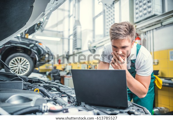 Young man with computer in\
service