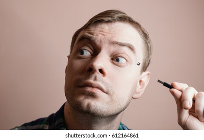 Young man with computer sockets in his head. Selective focus.