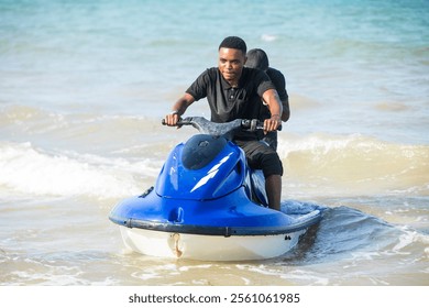 Young man concentrating while riding a jet-ski in the ocean.