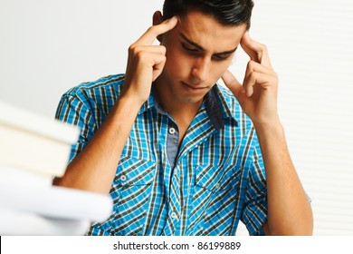 Young man concentrating while studying.