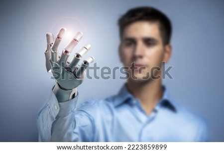 Young man controlling electronic robotic hand. 3d rendering. Connection to robotic limb. Conceptual image about cybernetics and bionics enhancement.
