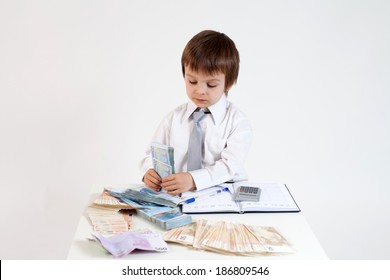 Young Man, Counting Money And Taking Notes