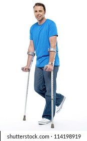 Young Man With Crutches Trying To Walk. Accidental Case