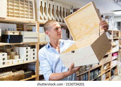 Young Man Customer Looking For Wooden Storage Box At Store Of Household Goods