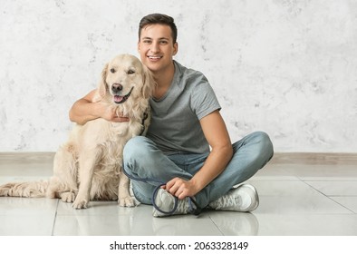 Young Man With Cute Dog Indoors