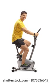 Young Man Cycling On A Stationary Bike And Looking At The Camera Isolated On White Background