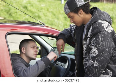Young Man Dealing Drugs From Car