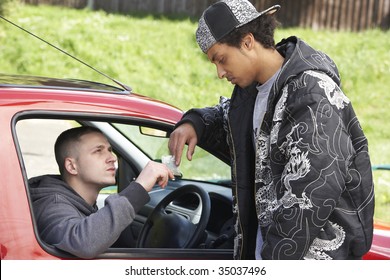 Young Man Dealing Drugs From Car