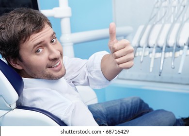 A Young Man In A Dental Chair